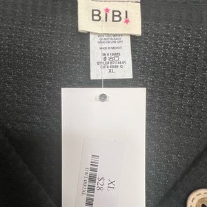 Cute, black waffle top with buttons and slight balloon sleeves